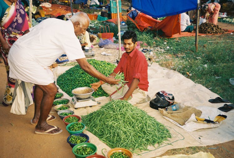 Man Buying Green Vegetables