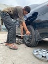 Man Using a Lug Wrench