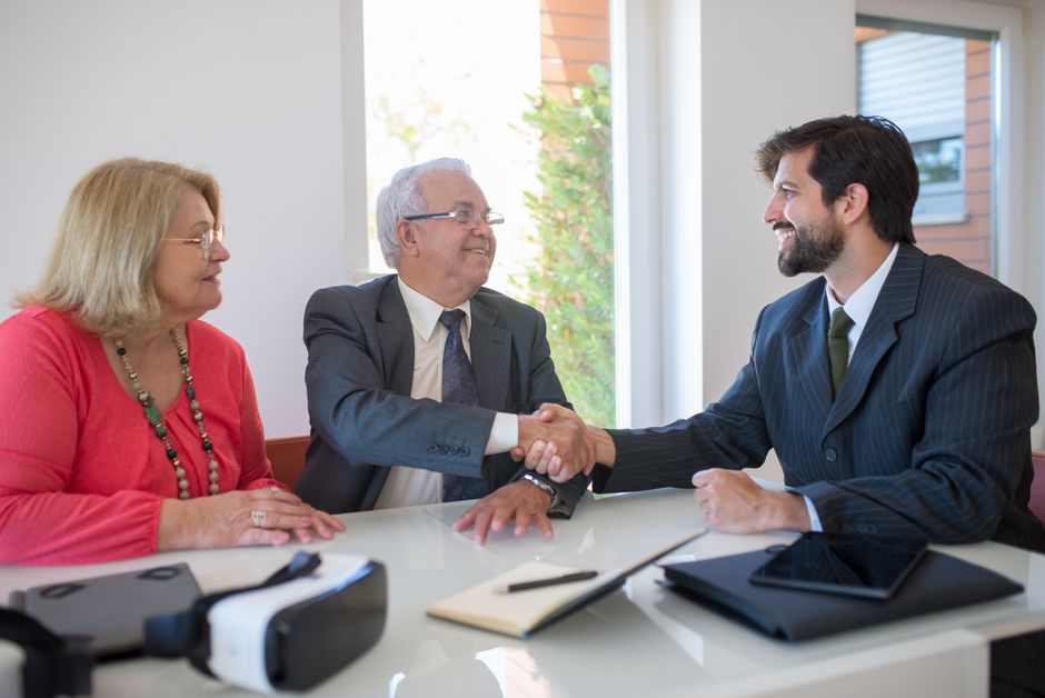 handshake between people in business attire - probate litigator