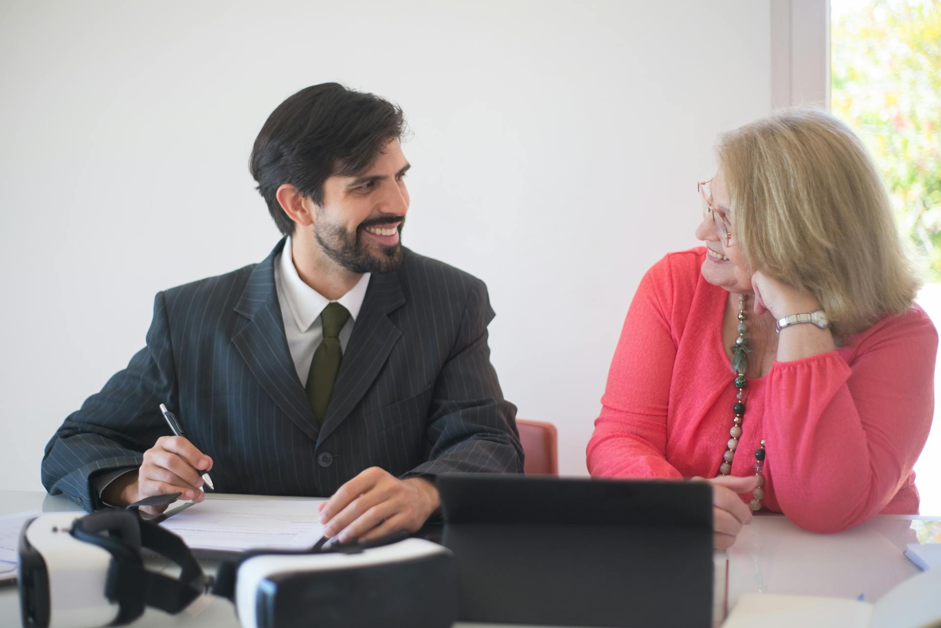 A Realtor and a Client During a Contract Signing