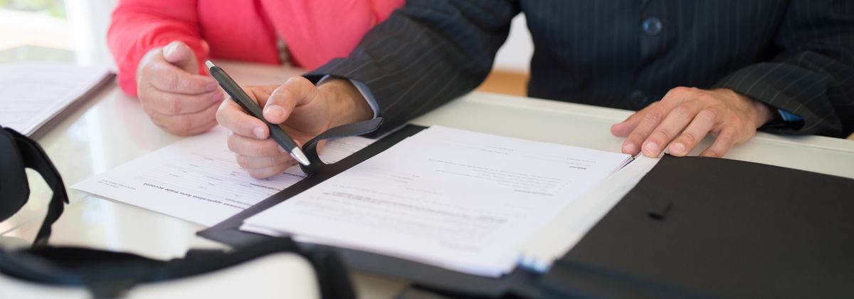 People reviewing documents at a desk