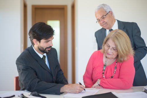 Salesman Discussing Real Estate to a Senior Couple
