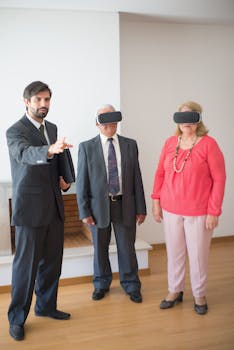 Business professional conducting a virtual reality real estate tour with clients in an indoor setting.