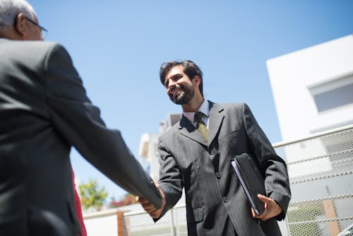 Men in Suits Shaking Hands