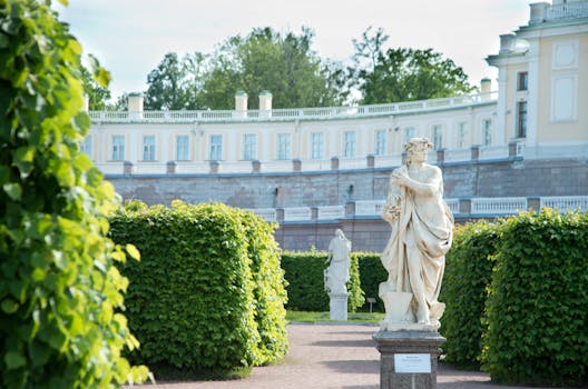 Photo of a Sculpture Near Green Leaves by Роман Помазов