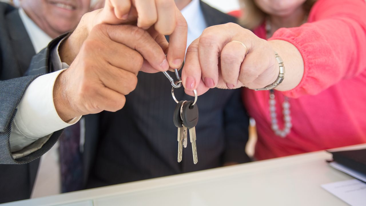 Stable affordable family housing plan Family home and keys representing a stable long-term affordable housing plan