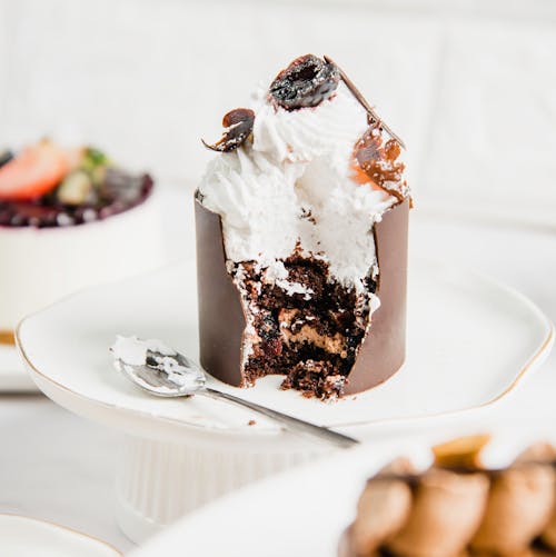 Chocolate Cake With Icing on White Ceramic Plate