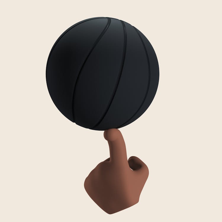 A Black Ball Balancing On A Finger