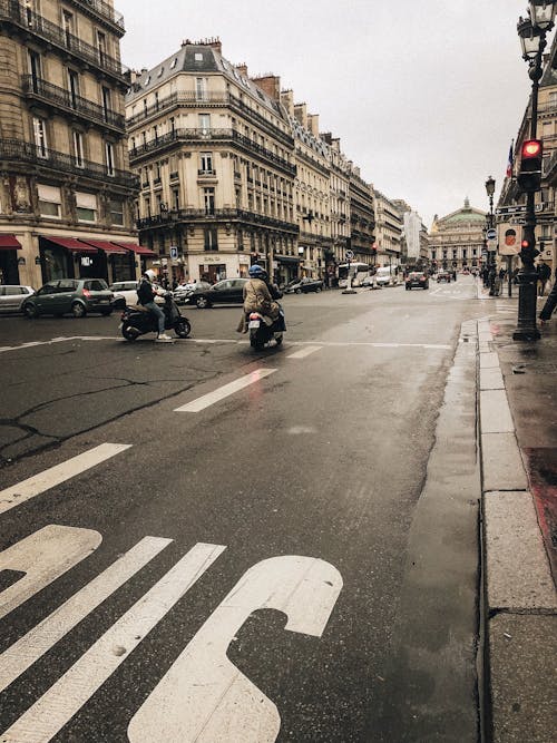 Photo of a Road with Vehicles Near Buildings