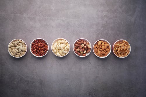 Close-Up Shot of Bowls of Nuts