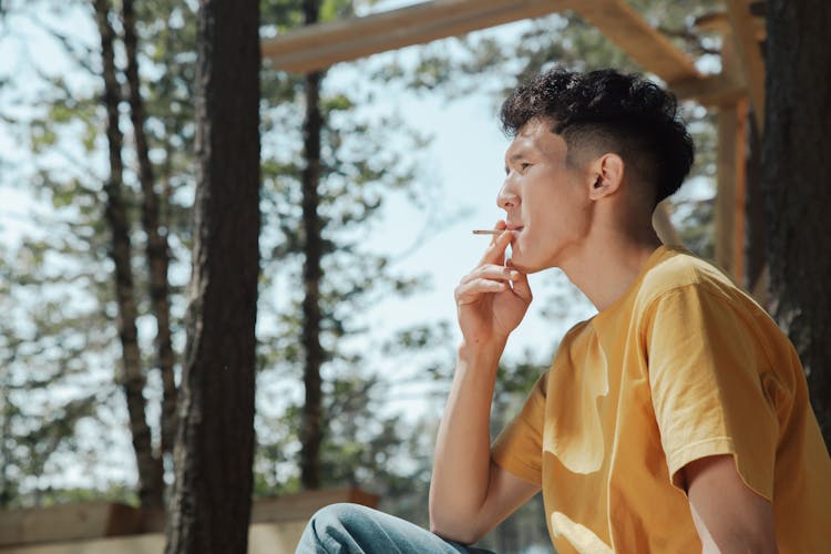 Man Smoking A Cigarette