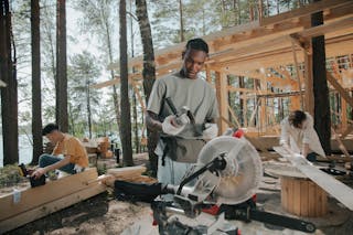 Men Constructing a Wooden House