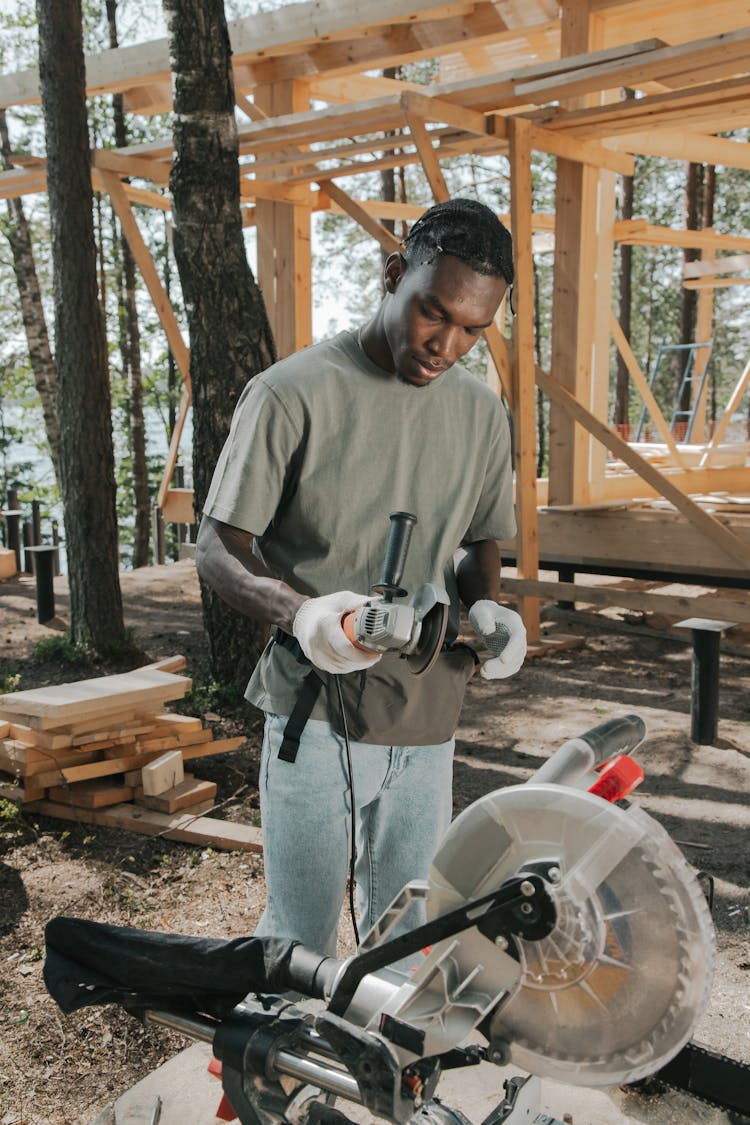 Construction Worker Holding A Grinder