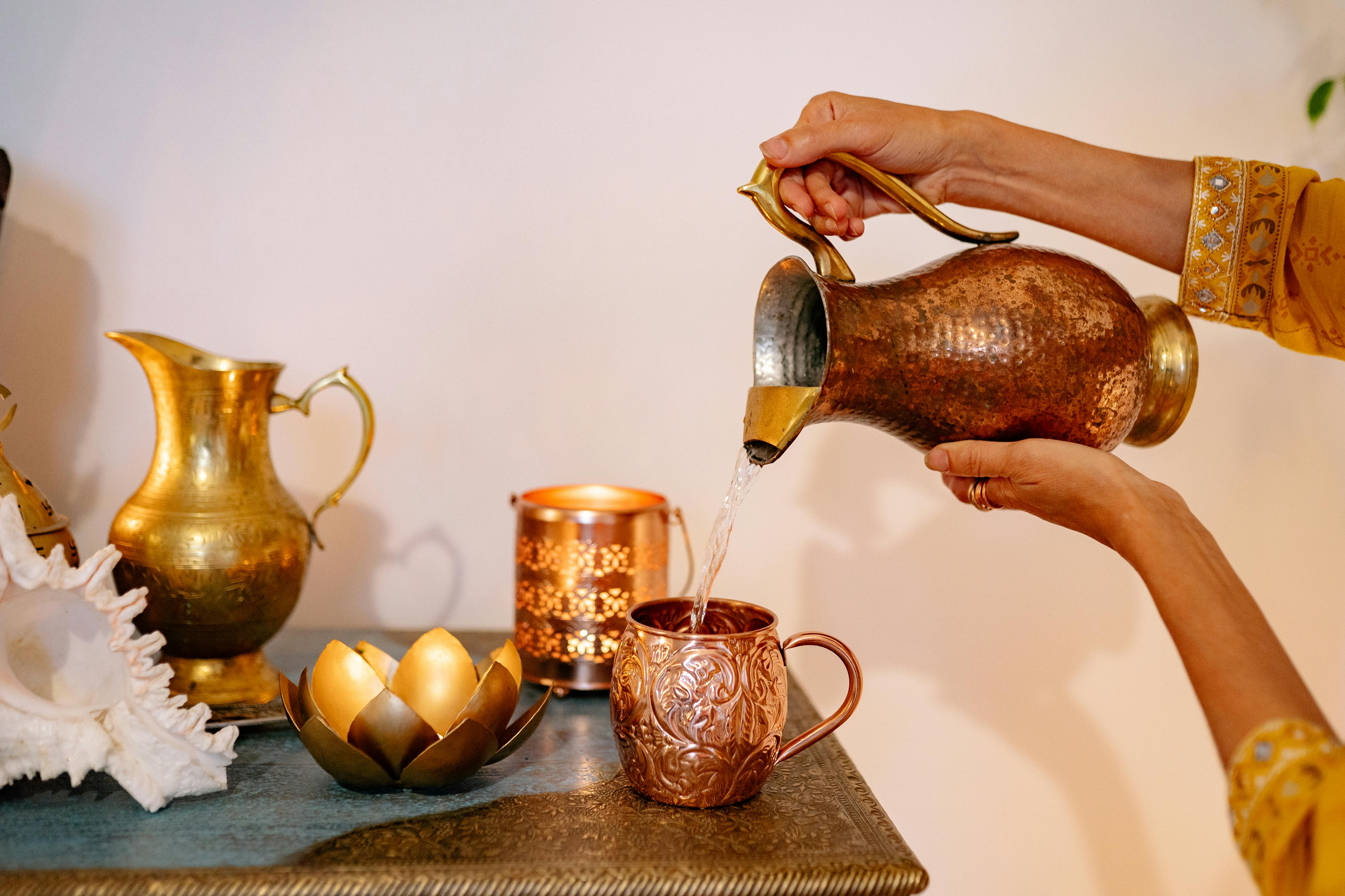 Water pouring from pitcher - ritual washing and spiritual purification