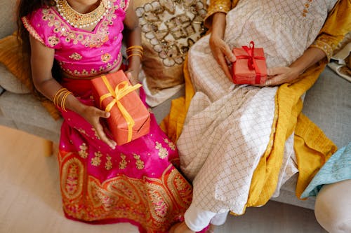 Women Holding Gifts on Lap