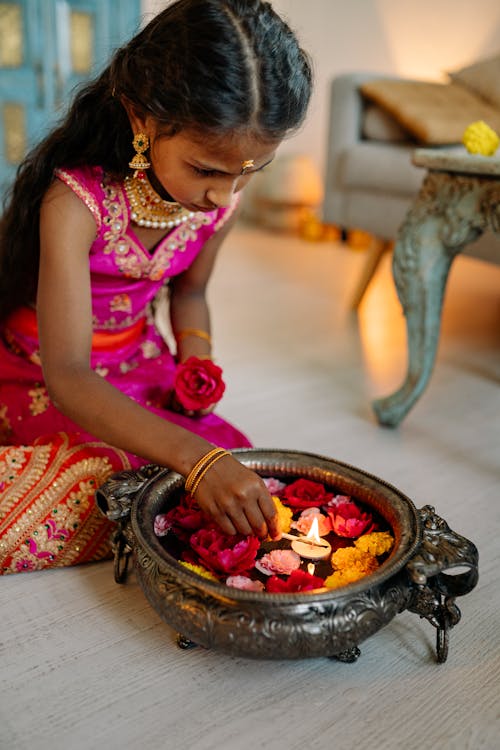 Girl Lighting a Tealight Candle