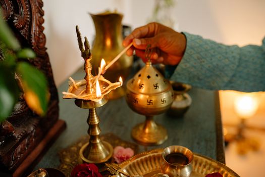 Hand of Person Igniting Incense