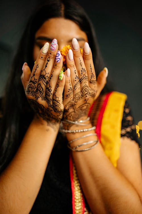 Free Hands of a Woman with Mehndi Stock Photo