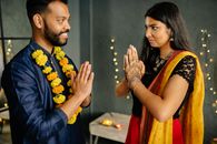 Man in Blue Dress Shirt Holding Womans Hand