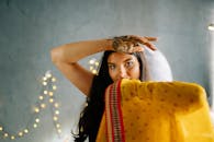 Woman in Yellow and Red Scarf