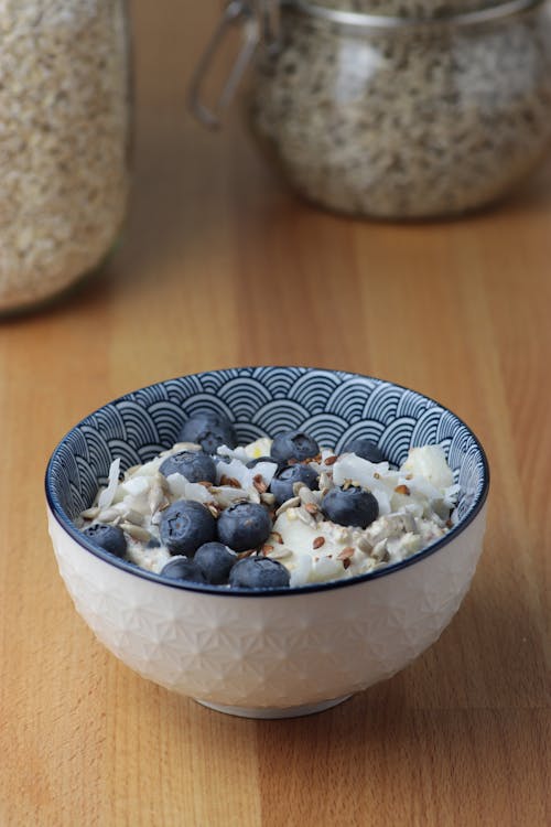 Free Breakfast Bowl with Oats and Blueberries  Stock Photo