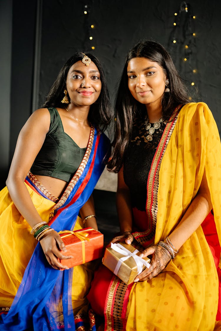 Women In Black Top And Yellow Scarfs