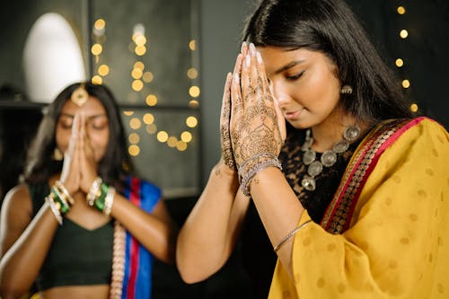 Women Wearing Sari Praying Together