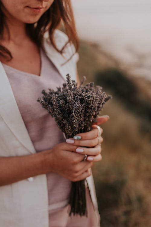 Free Woman Holding a Bouquet of Lavenders Stock Photo