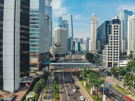 A vibrant aerial view of South Jakarta's urban skyline featuring modern skyscrapers and bustling streets.