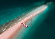 White Boat on Body of Water