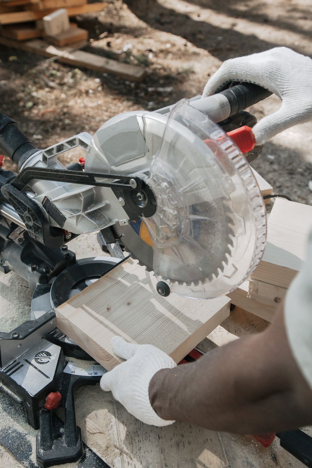 A Person Cutting Wood Using Circular Saw · Free Stock Photo