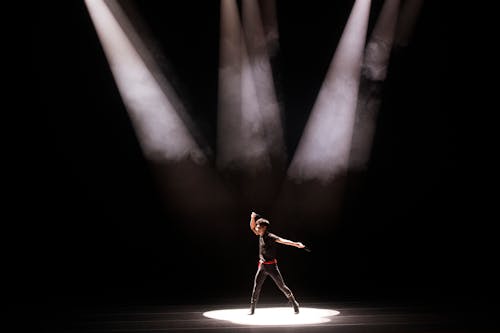 Free Woman in Red Dress Standing on Stage Stock Photo