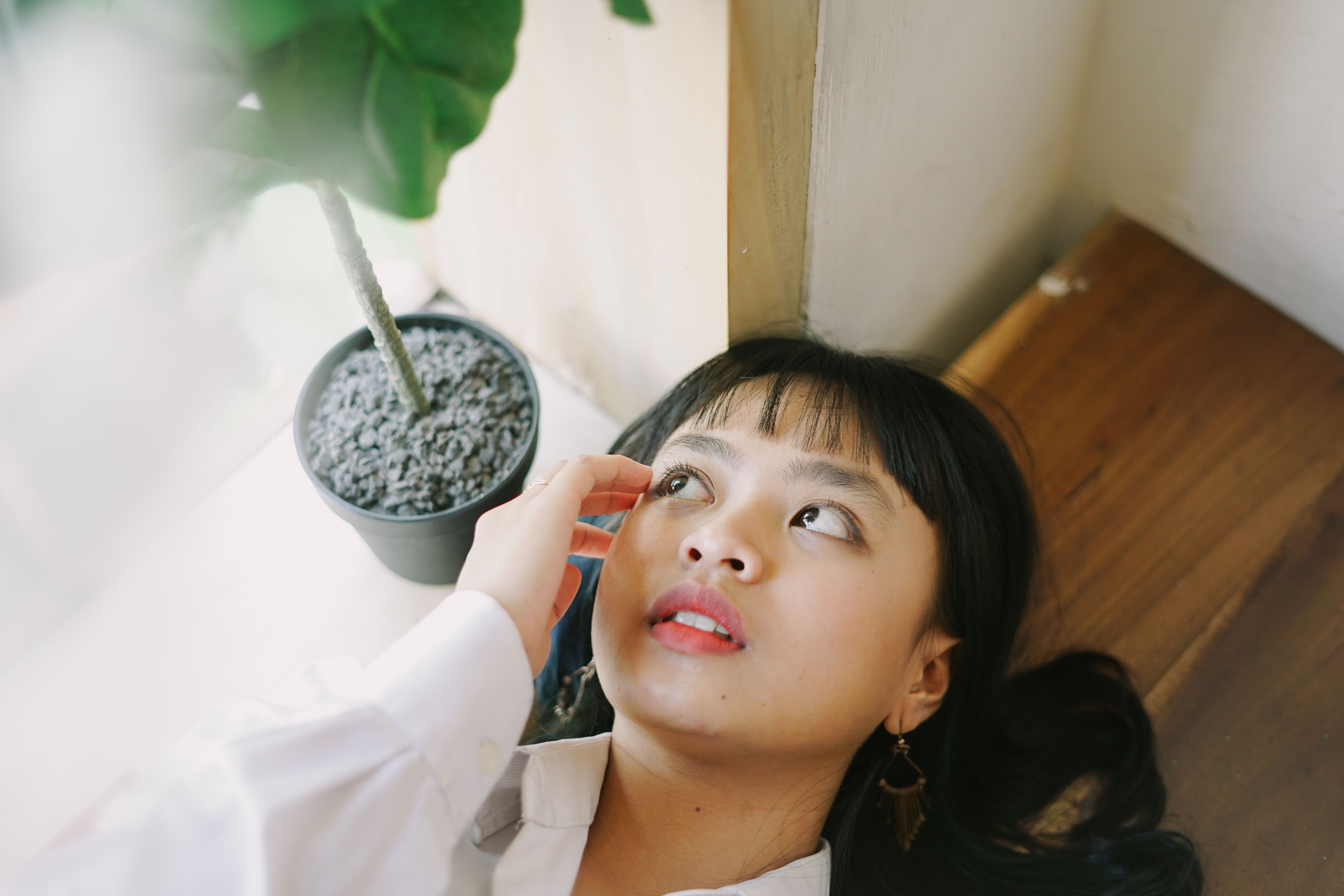 A Woman Lying Down on the Table · Free Stock Photo