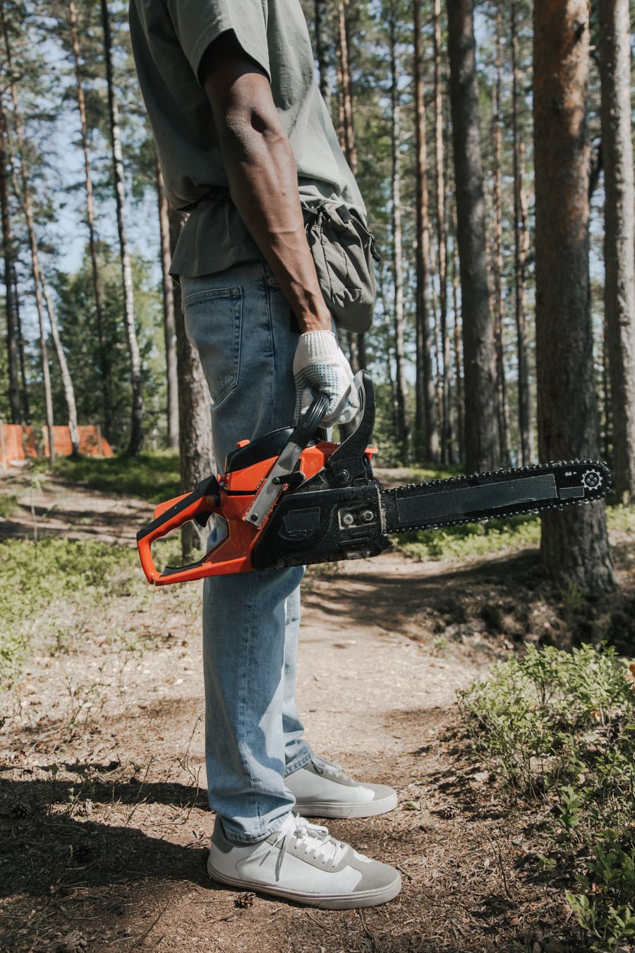 Tree service worker with chainsaw