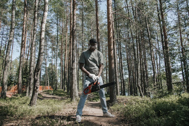 A Man Holding Chainsaw