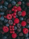 Red and Black Round Fruits