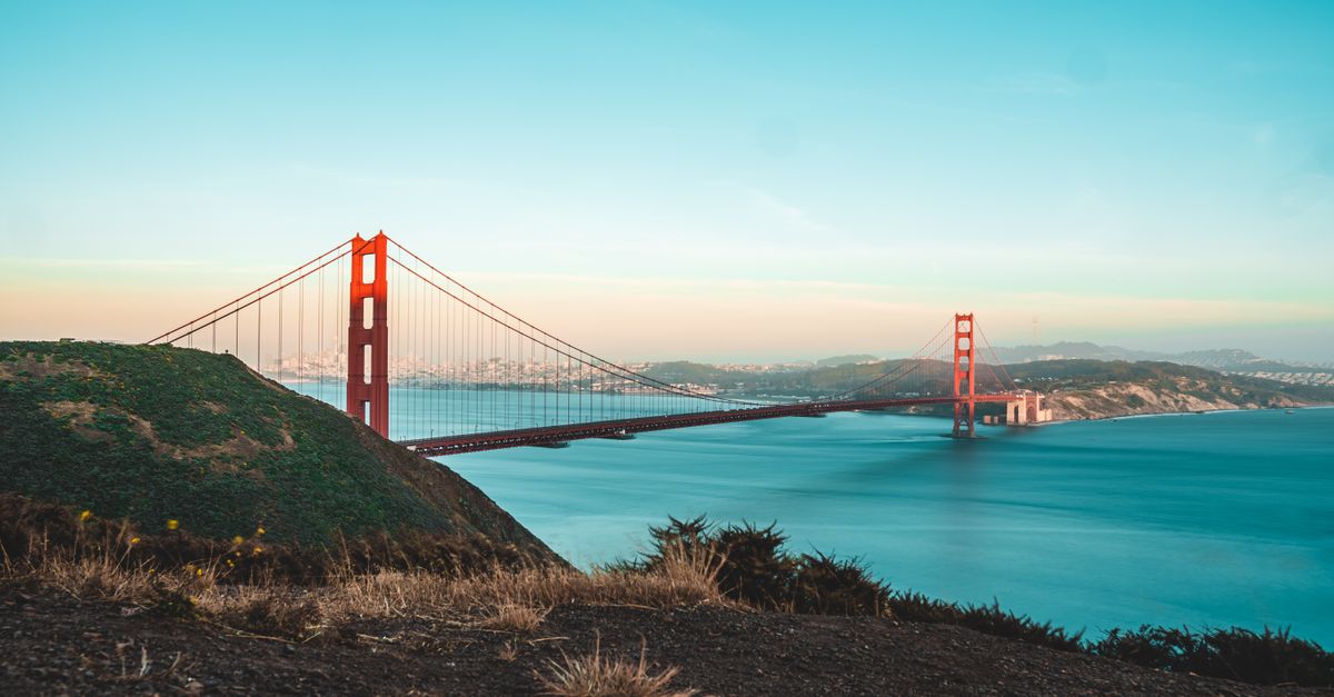 The Golden Gate Bridge at sunset over the ocean in San Francisco, California