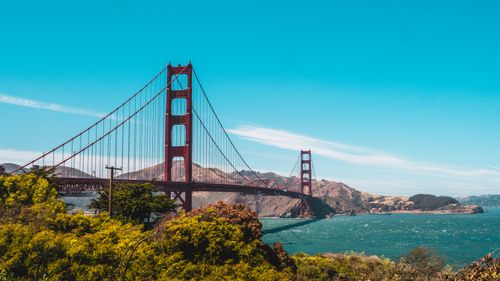 Free Scenic view of the iconic Golden Gate Bridge under a clear blue sky in San Francisco. Stock Photo