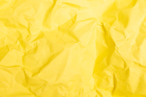 Free 
A Close-Up Shot of a Crumpled Yellow Paper Stock Photo