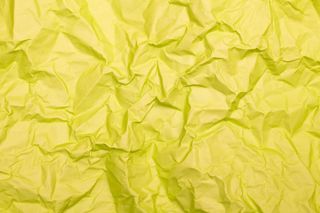 Crumpled paper on a yellow background — Tamanna Rumee on Pexels