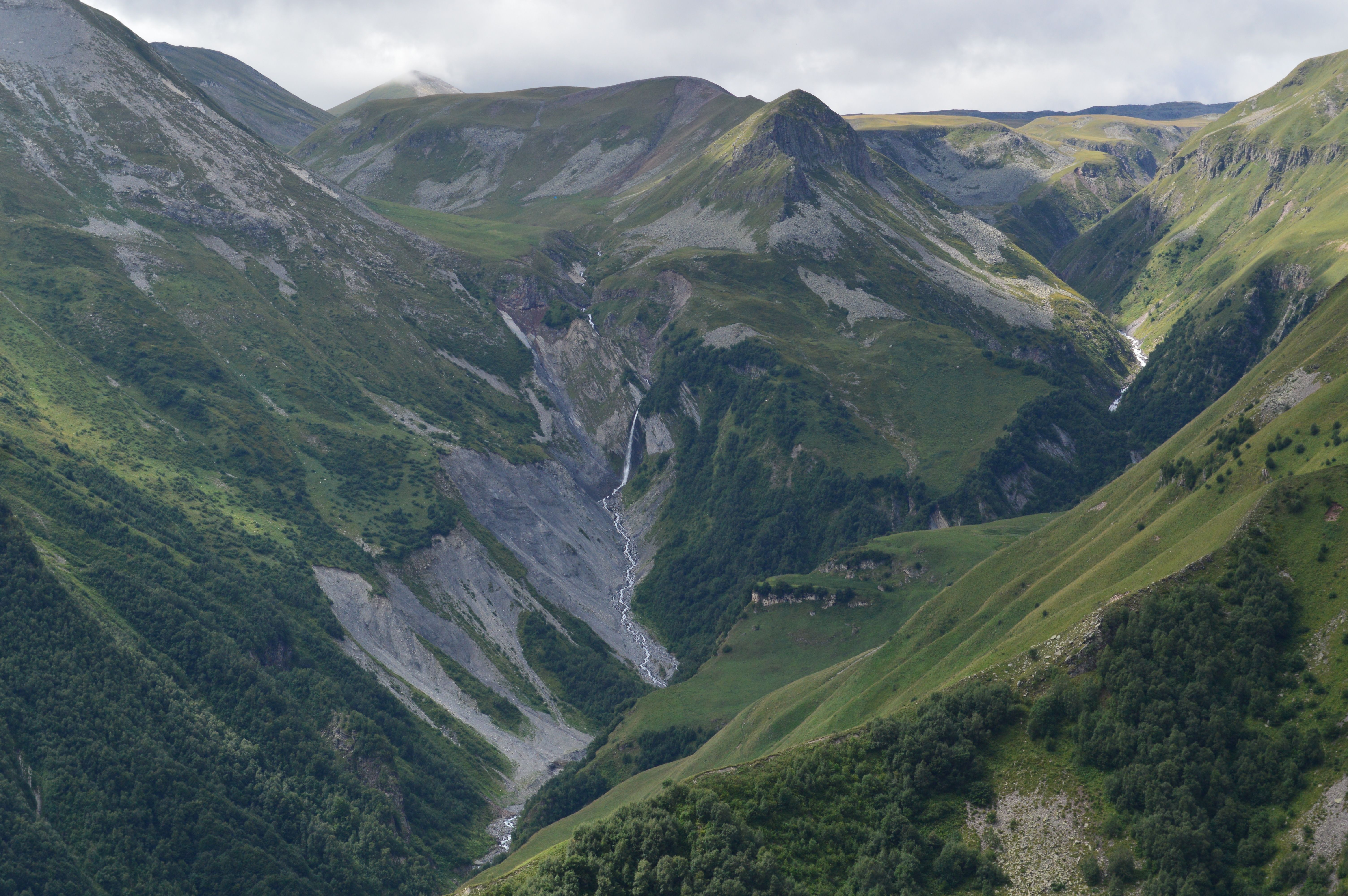 A mesmerizing aerial photograph of a lush mountain valley in Tbilisi, Georgia.