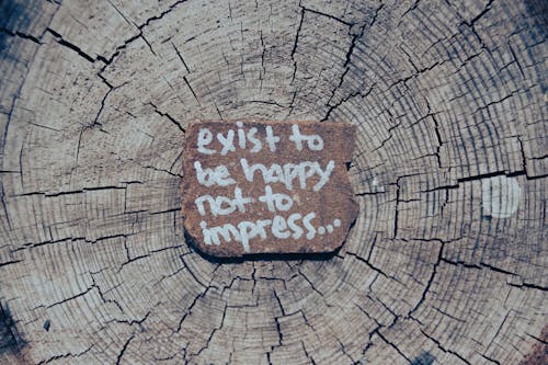 Inspirational Words on Wooden Log