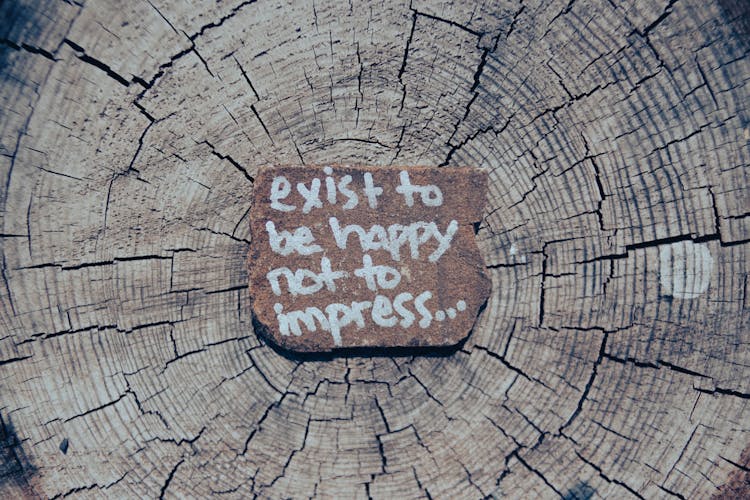 Inspirational Words On Wooden Log