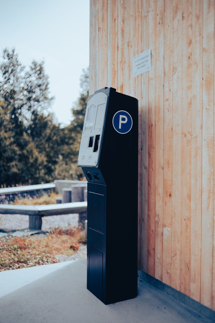 Parking Meter Standing By Wall