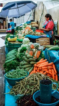 Colorful farmers market in Mexico showcasing fresh vegetables and local produce.