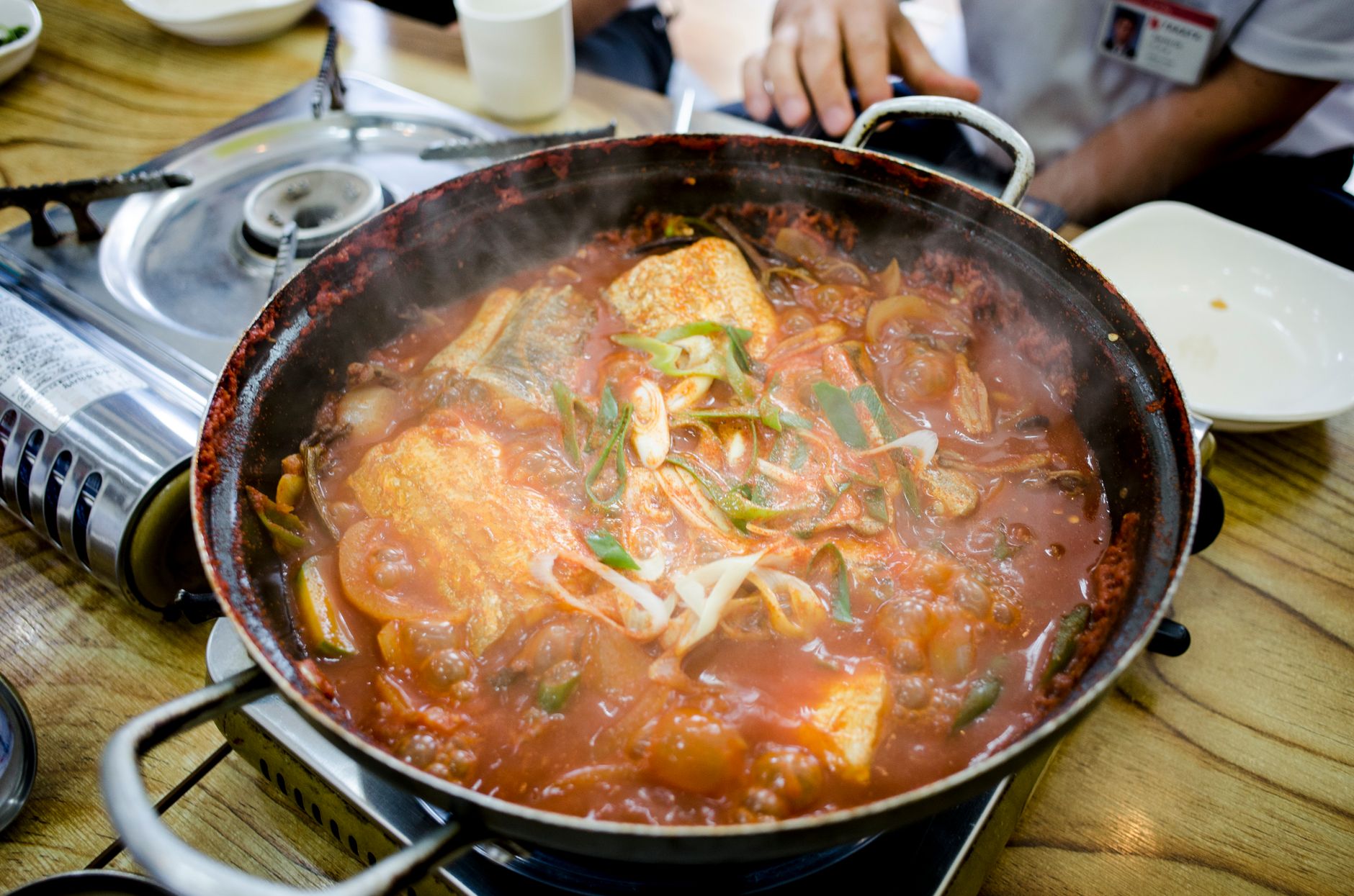 A vibrant spicy meat stew served with fragrant rice