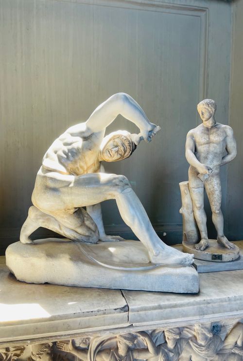 Free Two classical marble sculptures displayed in an indoor museum with detailed craftsmanship. Stock Photo