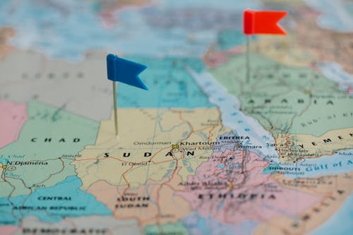 Free Blue and Red Tiny Flags on Map  Stock Photo