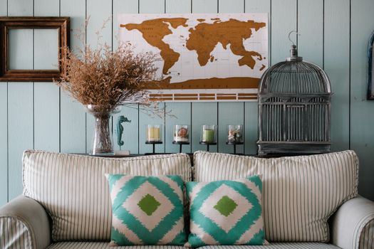 White and Green Striped Sofa with Throw Pillows