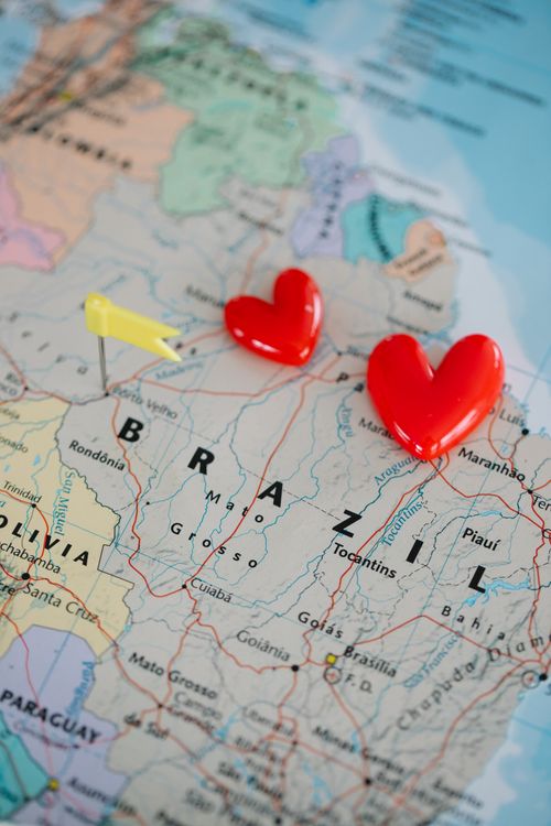 Free Conceptual photo of a Brazil map with heart markers, symbolizing love or travel plans. Stock Photo